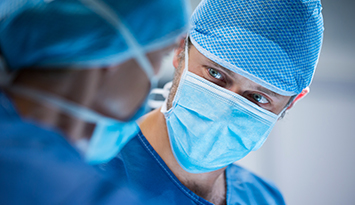 Surgeons interacting while performing operation