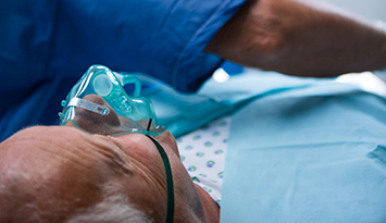 Surgeons performing operation in operation room